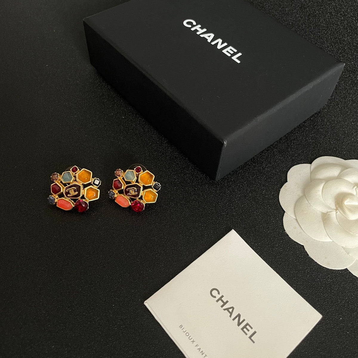 Martin Graham stud earrings in polished metal-tone – close-up detail