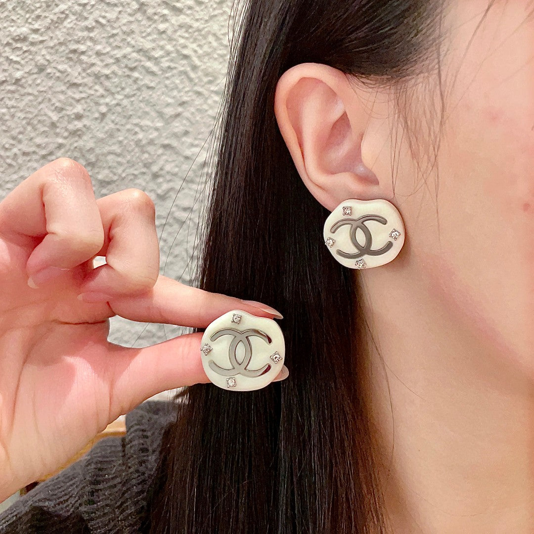 Martin Graham stud earrings in polished metal-tone – side detail