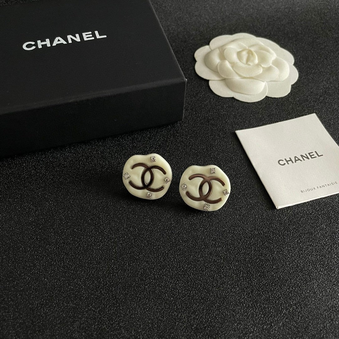 Martin Graham stud earrings in polished metal-tone – styled product view