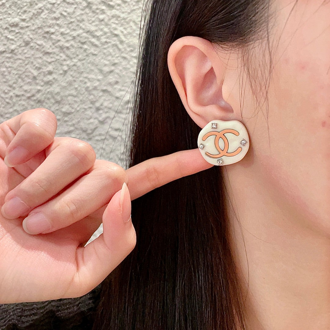 Martin Graham stud earrings in polished metal-tone – detail view