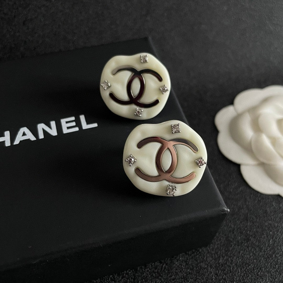 Martin Graham stud earrings in polished metal-tone – detail view