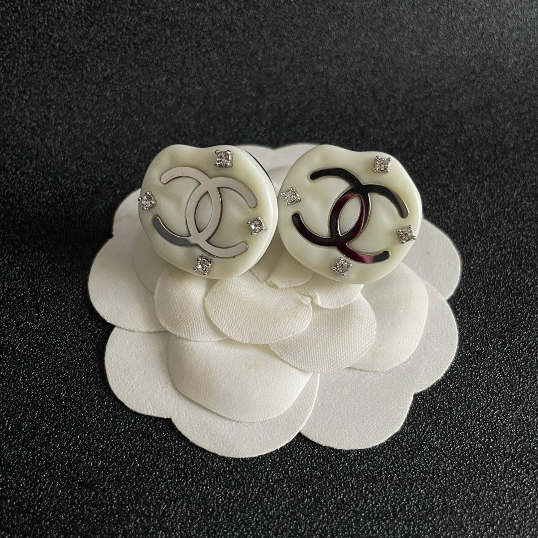 Martin Graham stud earrings in polished metal-tone – front product view