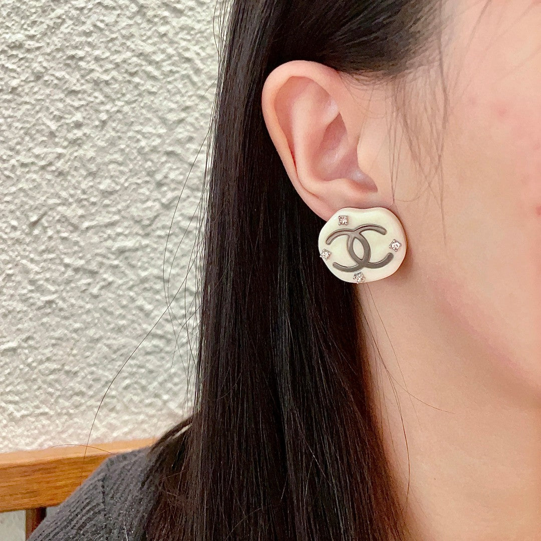 Martin Graham stud earrings in polished metal-tone – front product view