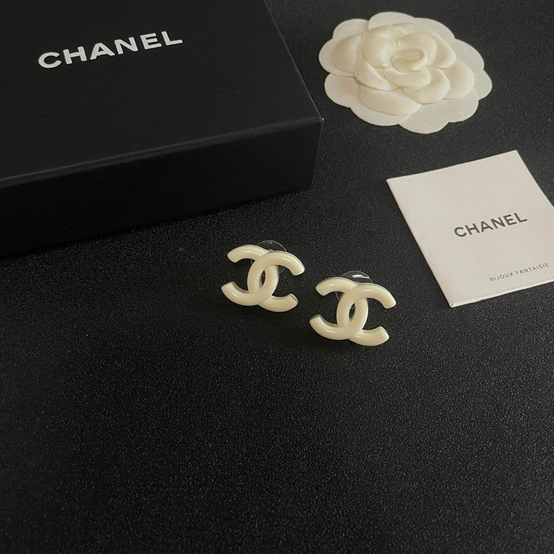 Martin Graham stud earrings in polished metal-tone – styled product view