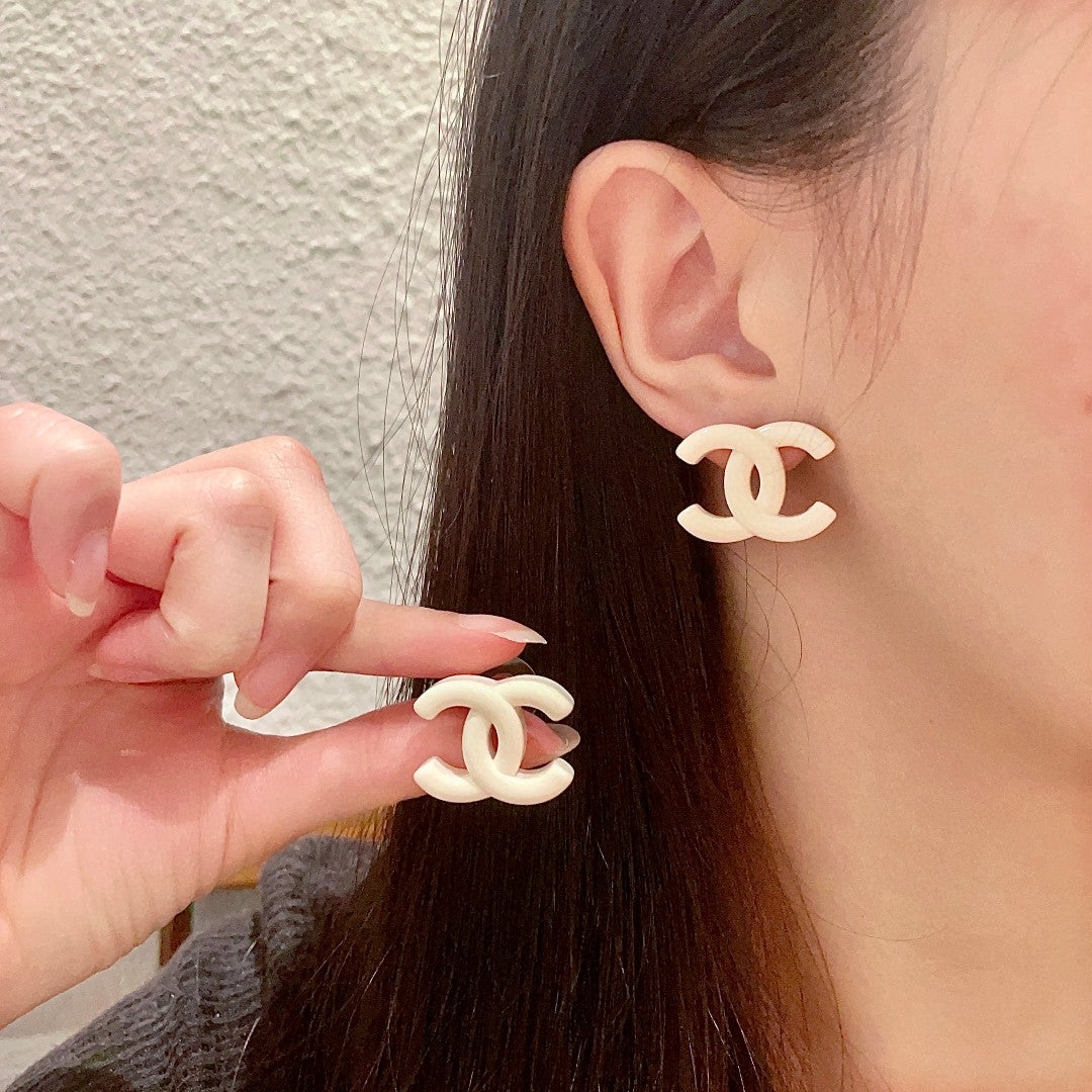 Martin Graham stud earrings in polished metal-tone – main product view
