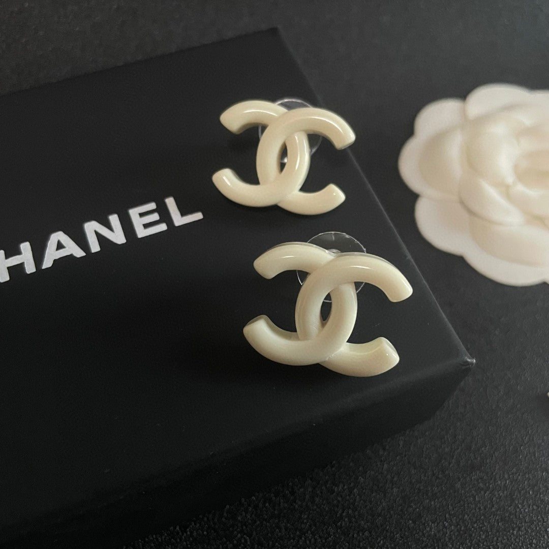 Martin Graham stud earrings in polished metal-tone – detail view
