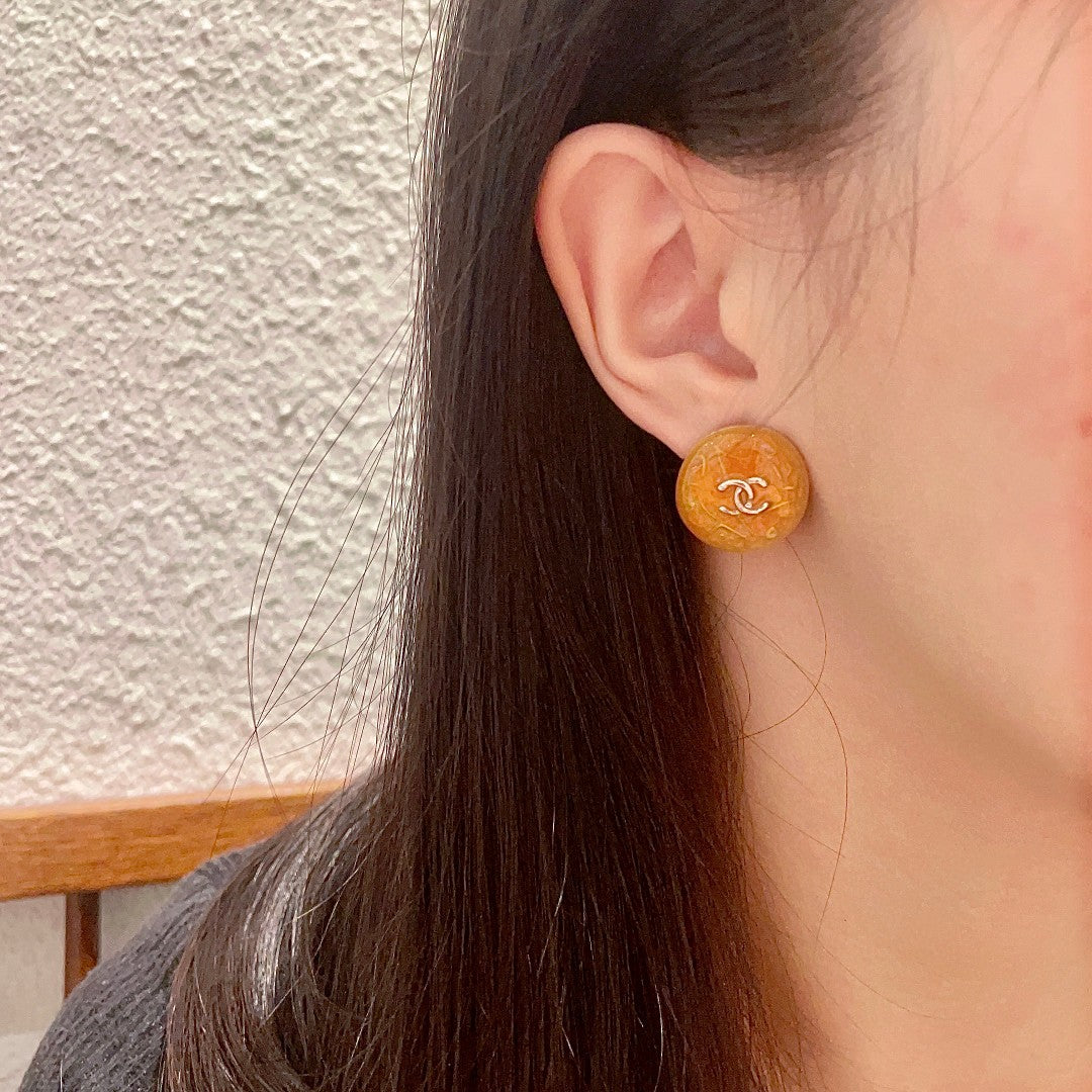Martin Graham stud earrings in polished metal-tone – detail view