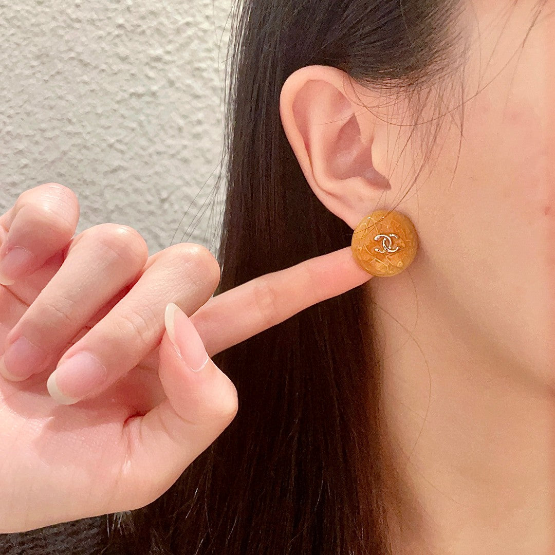 Martin Graham stud earrings in polished metal-tone – front product view