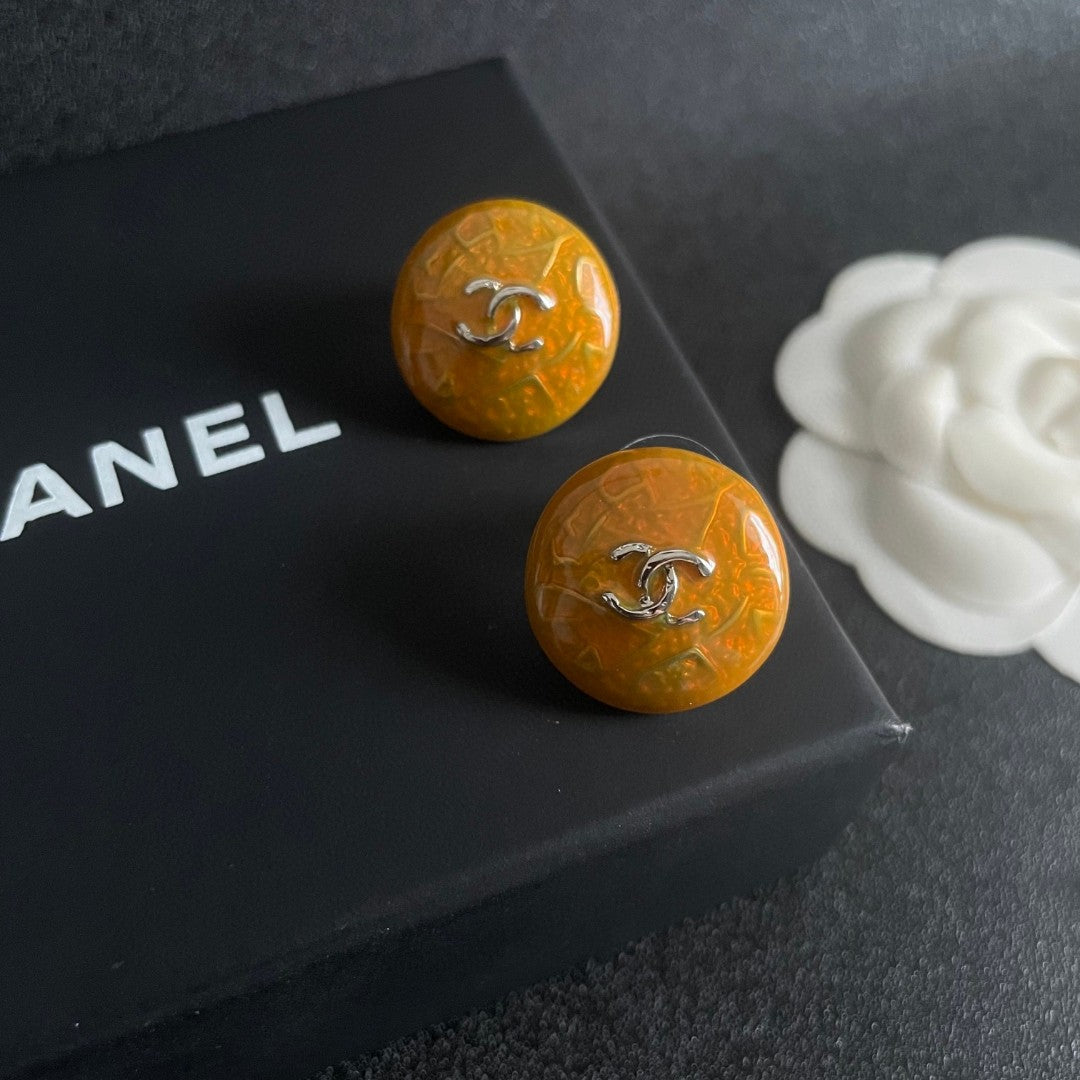 Martin Graham stud earrings in polished metal-tone – detail view