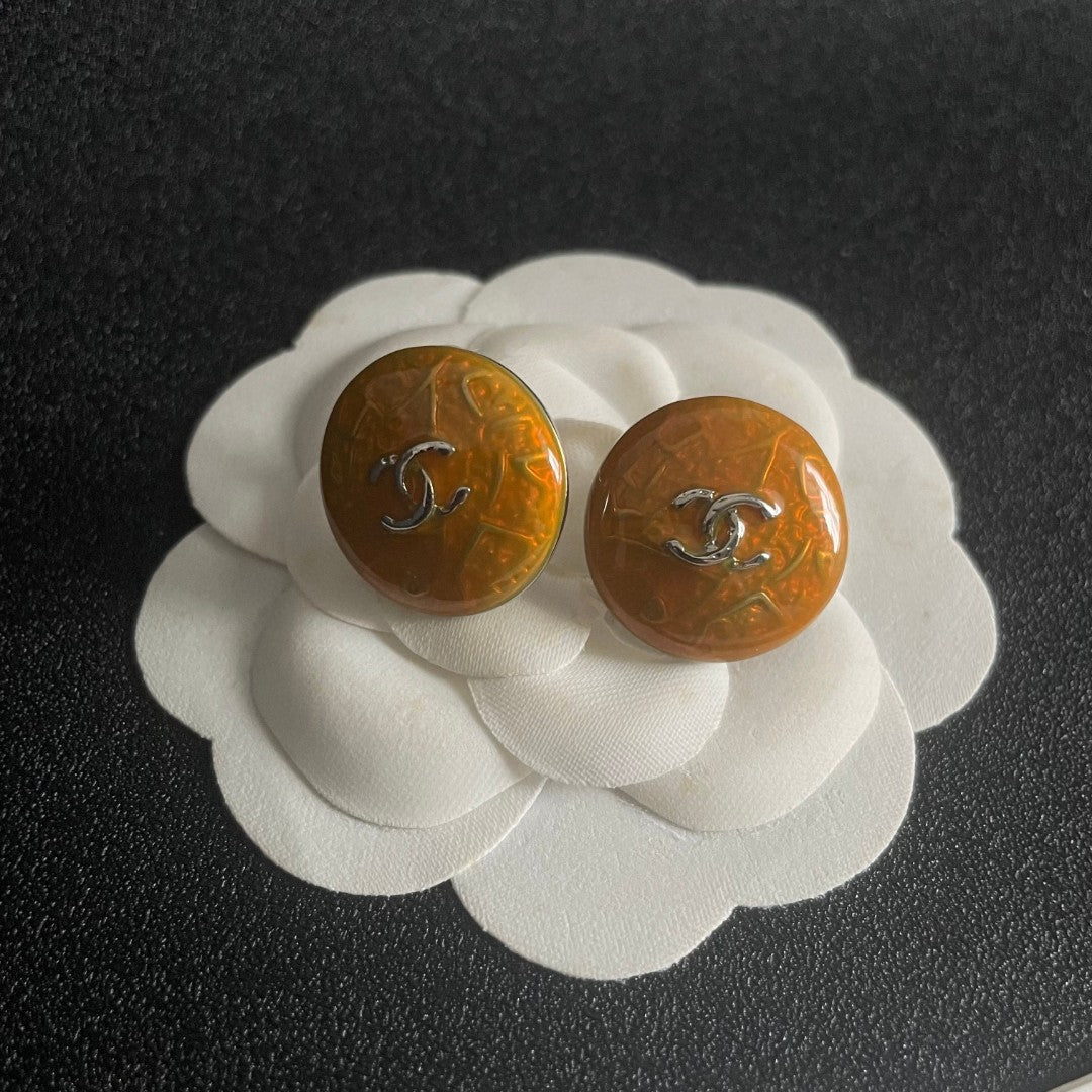 Martin Graham stud earrings in polished metal-tone – front product view