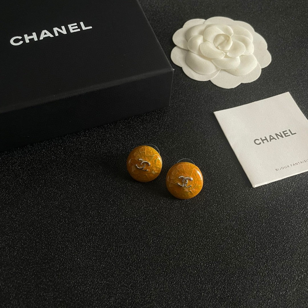 Martin Graham stud earrings in polished metal-tone – styled product view