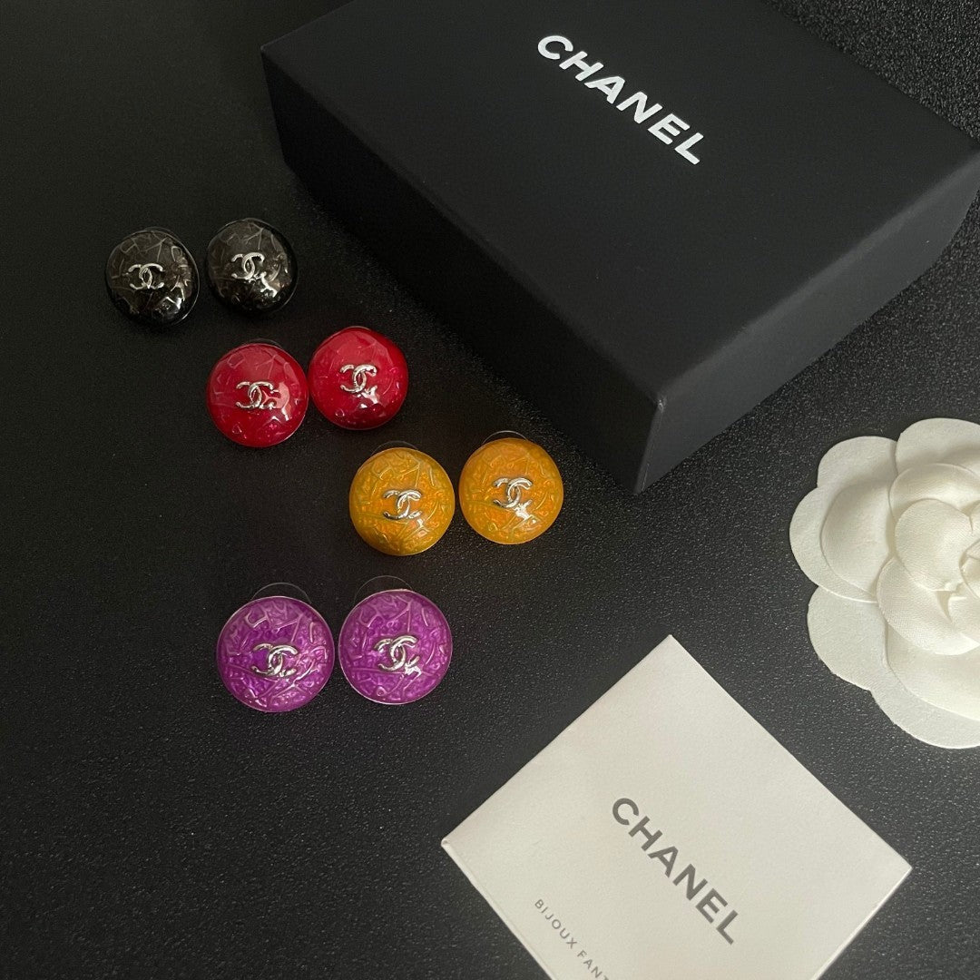 Martin Graham stud earrings in polished metal-tone – close-up detail