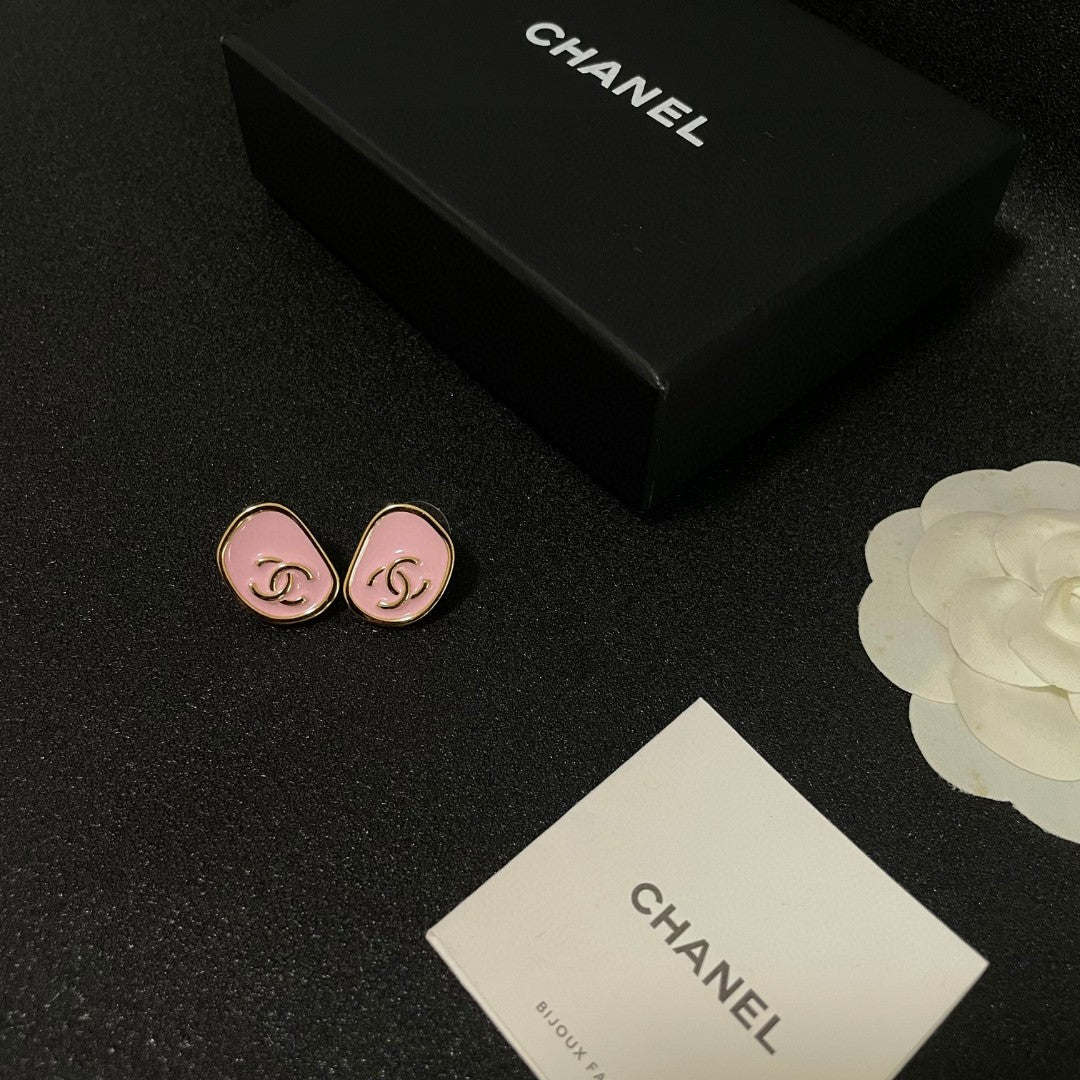 Martin Graham stud earrings in polished metal-tone – close-up detail