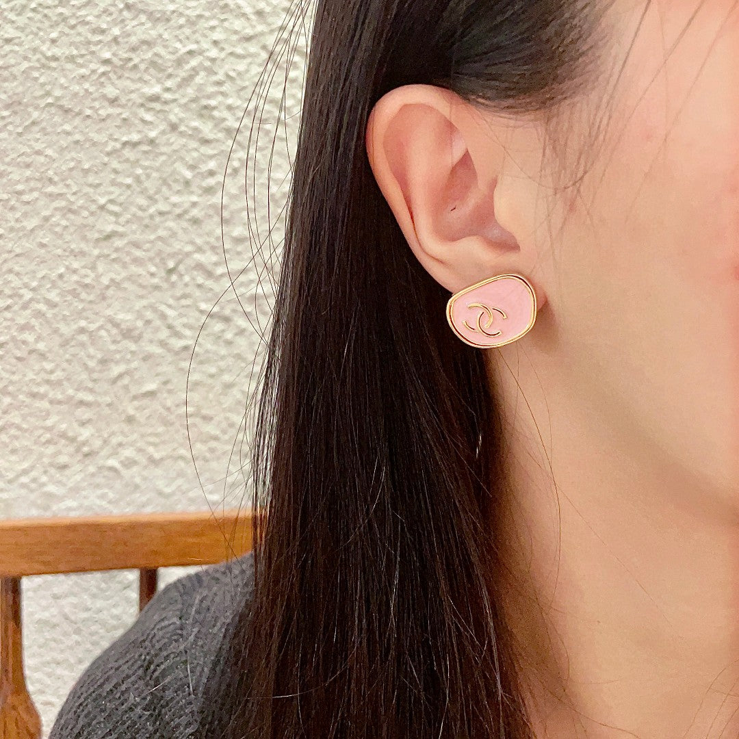 Martin Graham stud earrings in polished metal-tone – detail view