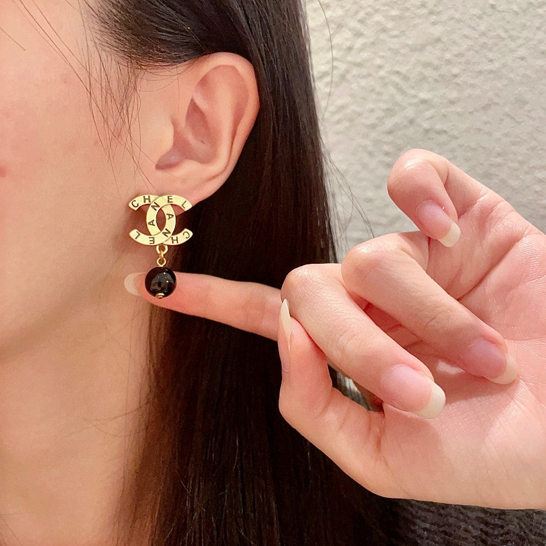 Martin Graham earrings in polished metal-tone – front product view
