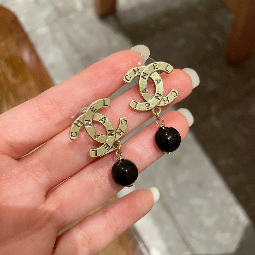 Martin Graham earrings in polished metal-tone – side detail