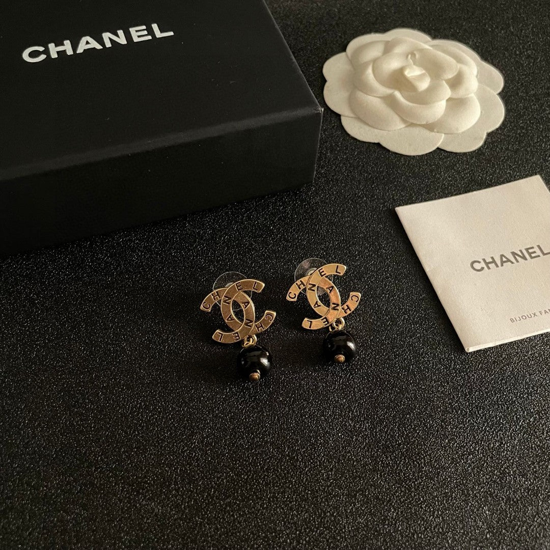 Martin Graham earrings in polished metal-tone – styled product view