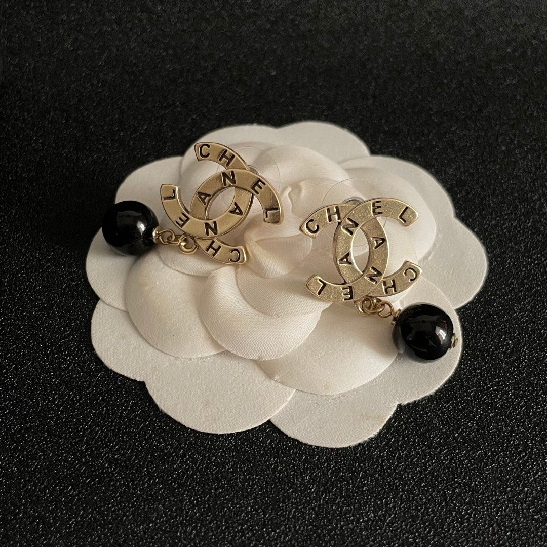Martin Graham earrings in polished metal-tone – front product view