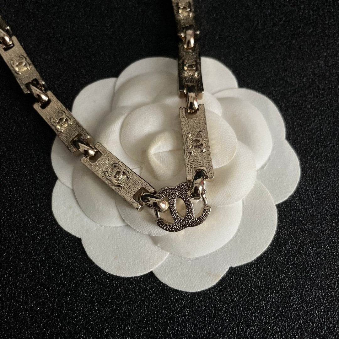 Martin Graham pendant necklace in polished metal-tone – front product view