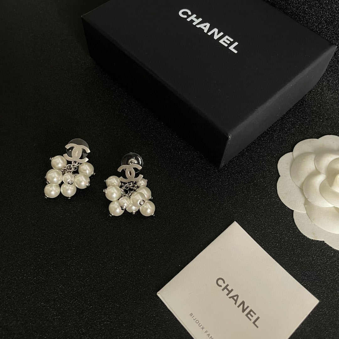 Martin Graham earrings in polished metal-tone – close-up detail