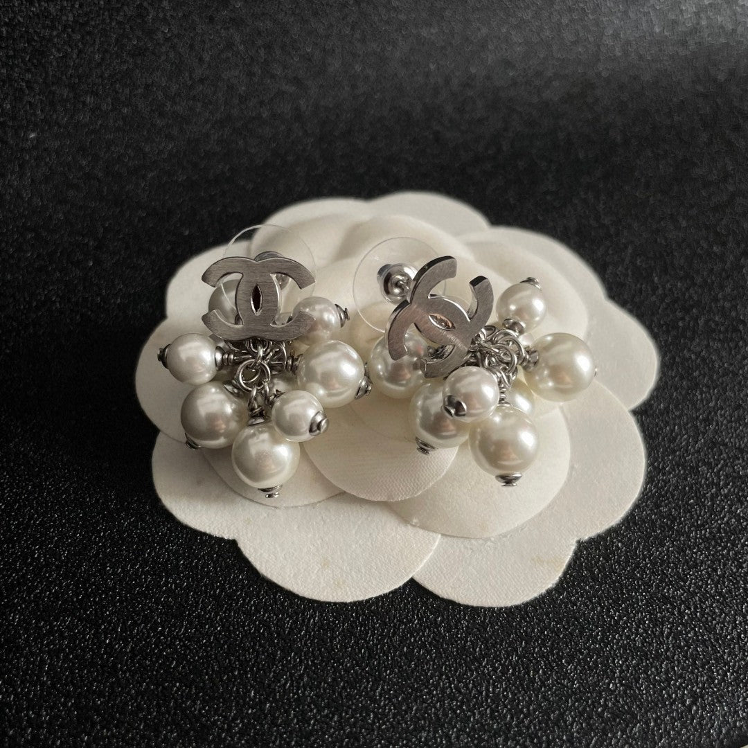 Martin Graham earrings in polished metal-tone – front product view