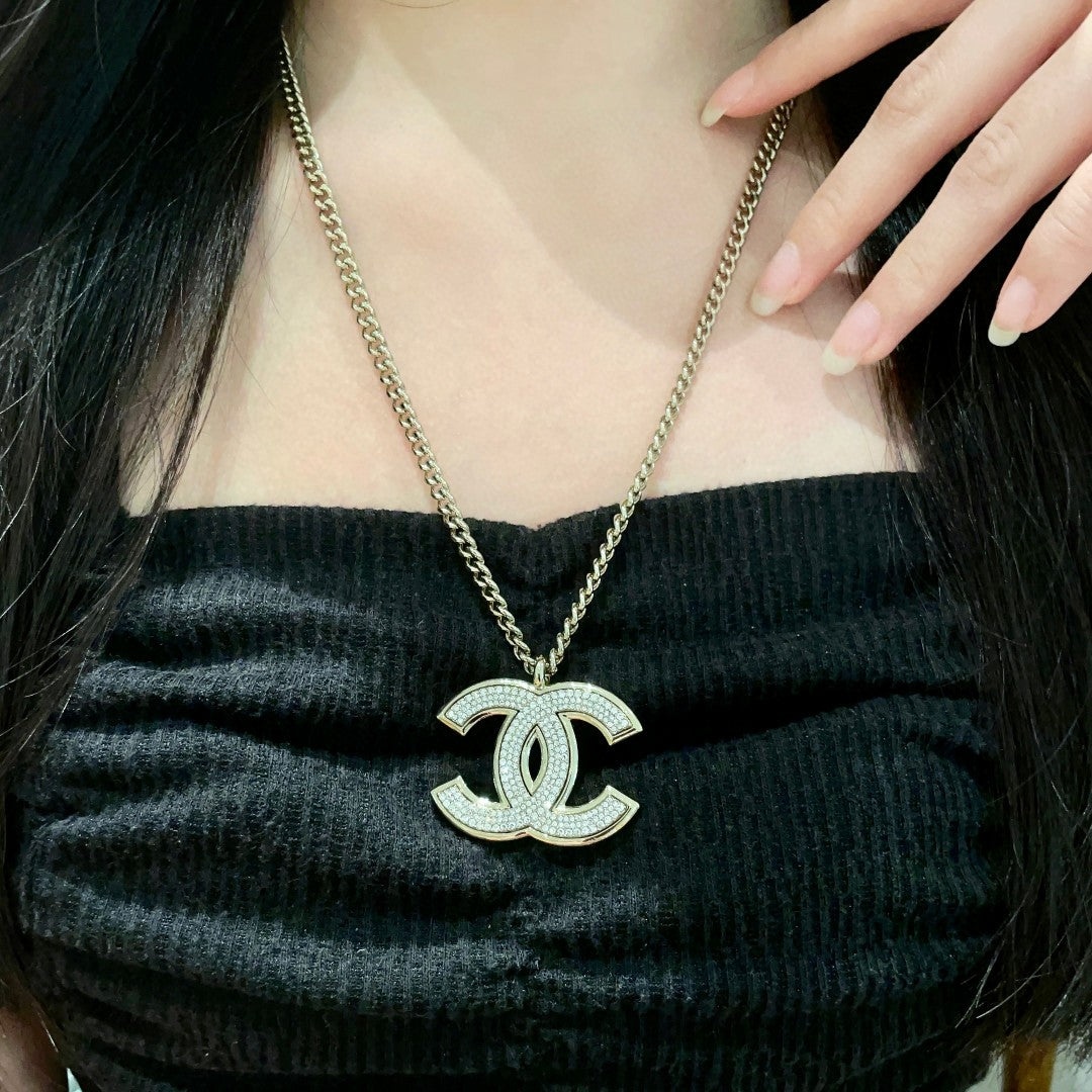 Martin Graham pendant necklace in polished metal-tone – detail view