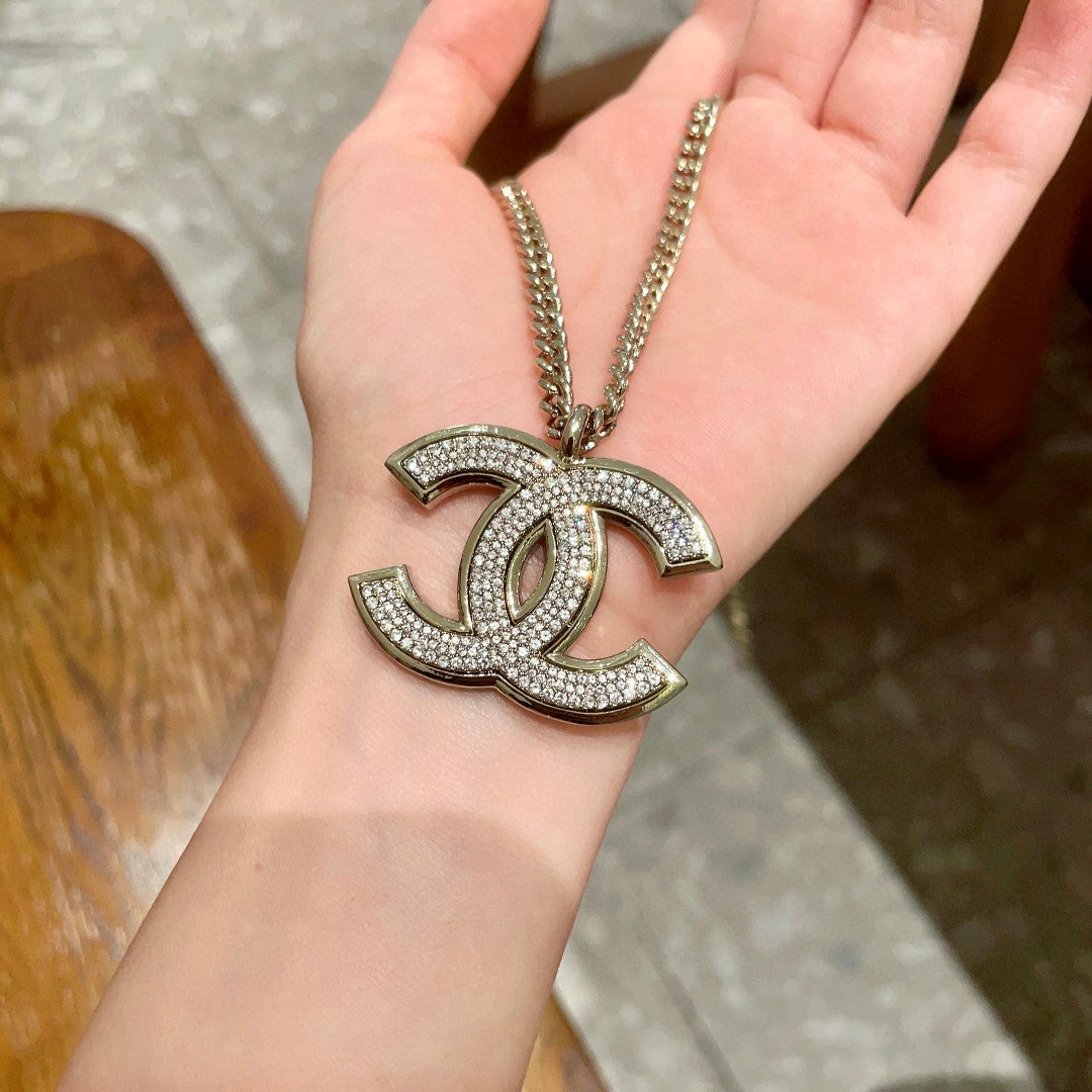 Martin Graham pendant necklace in polished metal-tone – styled product view