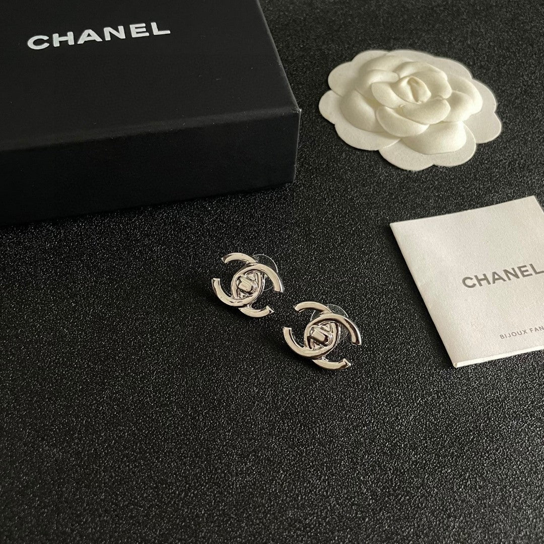 Martin Graham stud earrings in polished metal-tone – styled product view