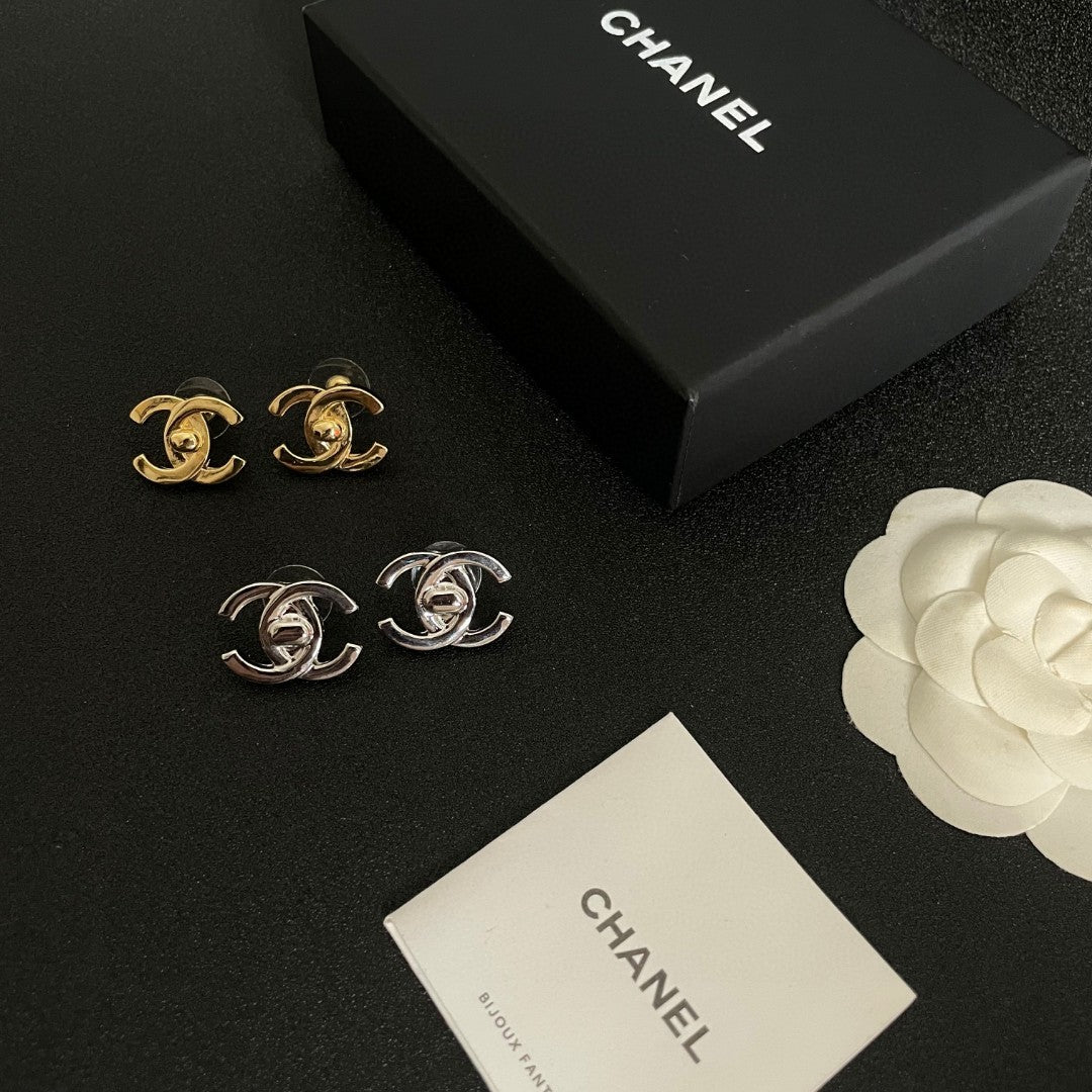 Martin Graham stud earrings in polished metal-tone – close-up detail