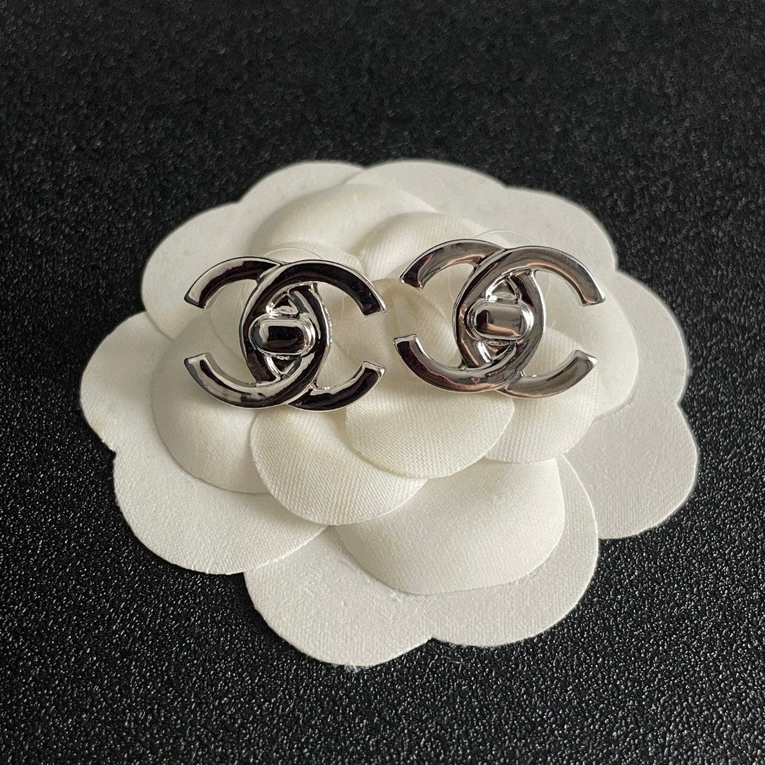 Martin Graham stud earrings in polished metal-tone – front product view