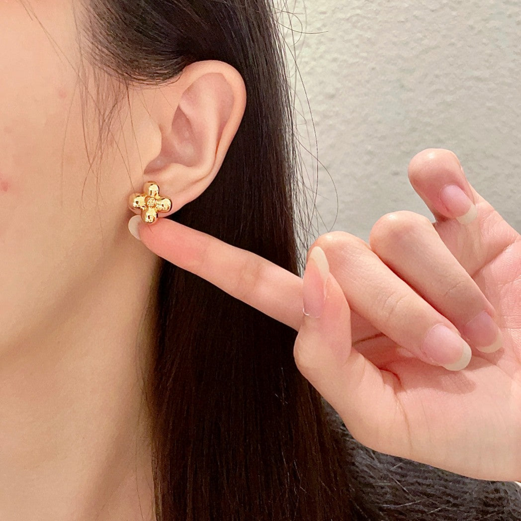 Martin Graham stud earrings in polished metal-tone – front product view