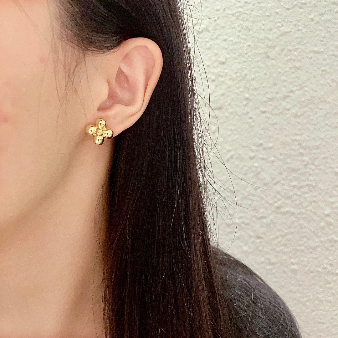 Martin Graham stud earrings in polished metal-tone – detail view
