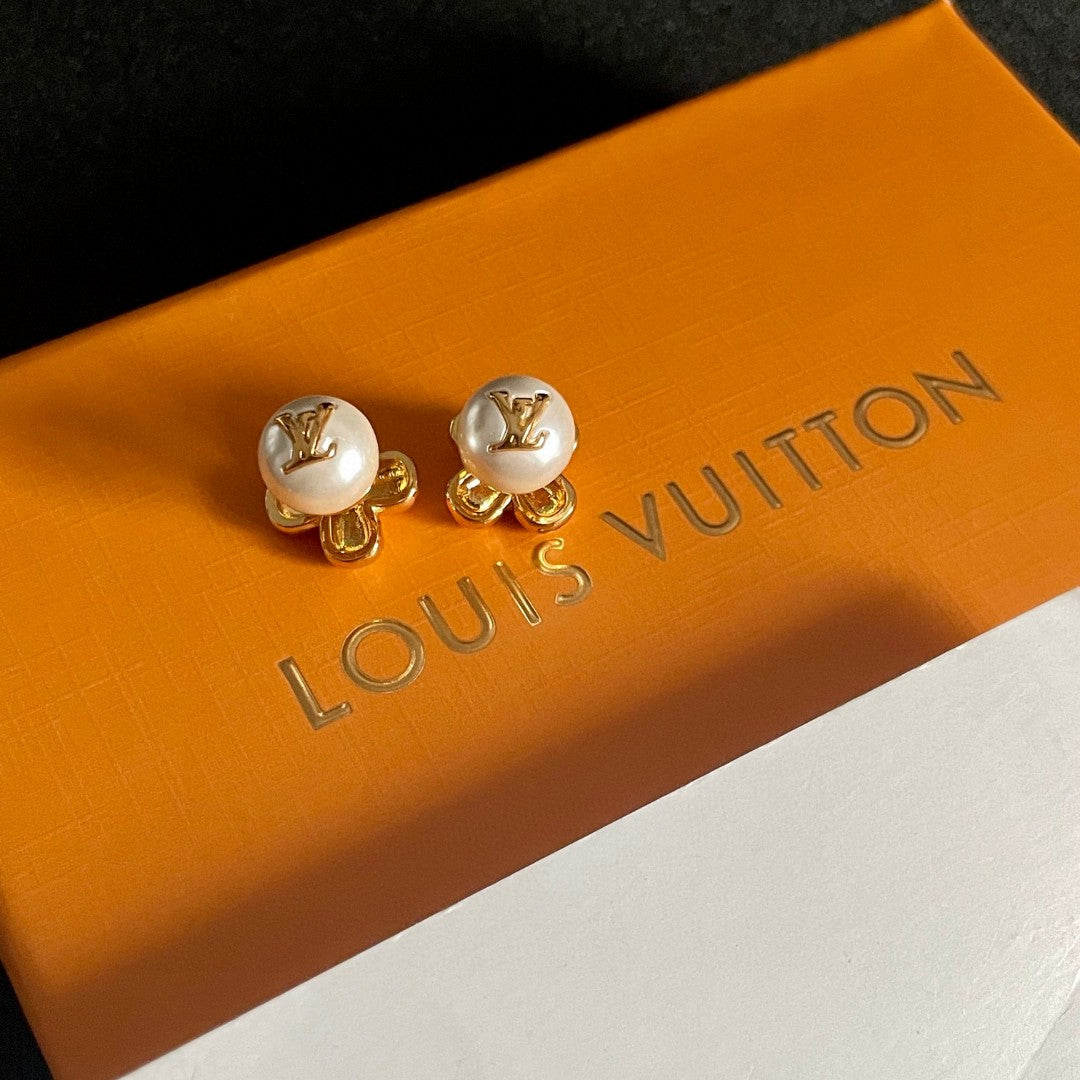 Martin Graham stud earrings in polished metal-tone – close-up detail