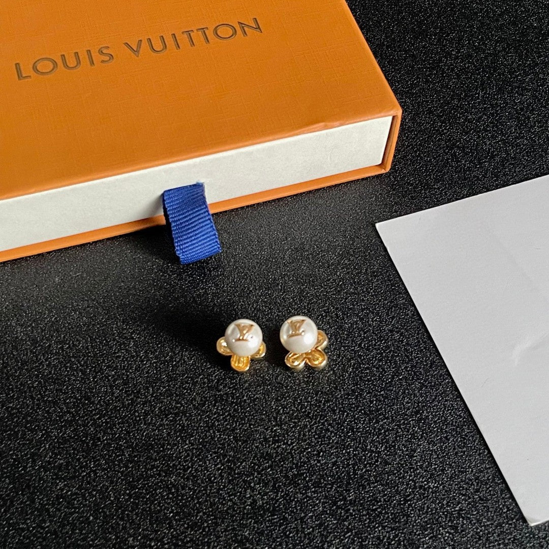 Martin Graham stud earrings in polished metal-tone – styled product view