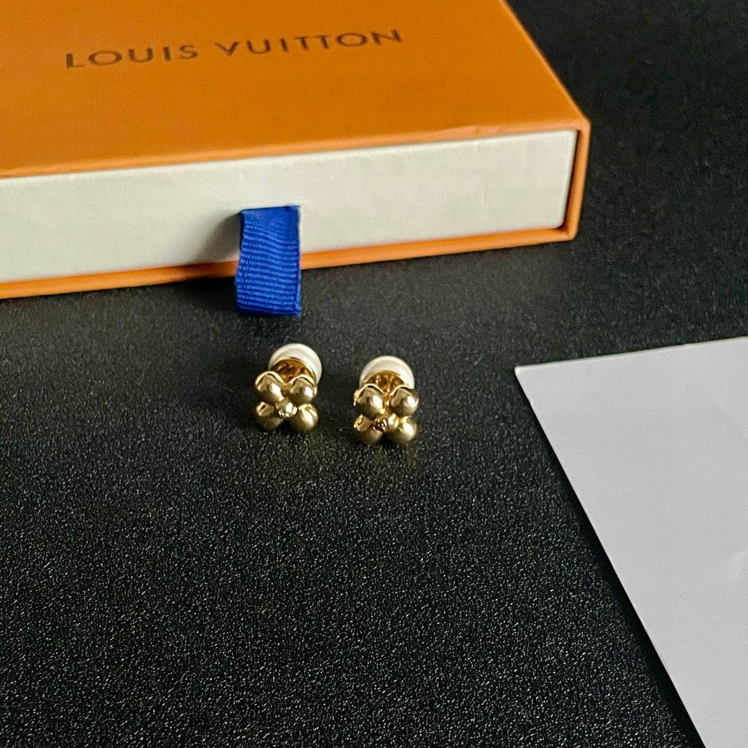 Martin Graham stud earrings in polished metal-tone – side detail