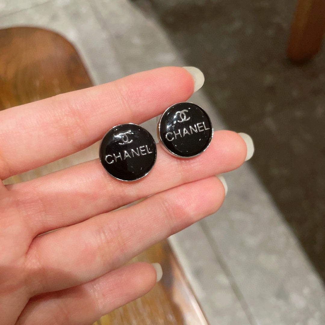 Martin Graham stud earrings in polished metal-tone – side detail