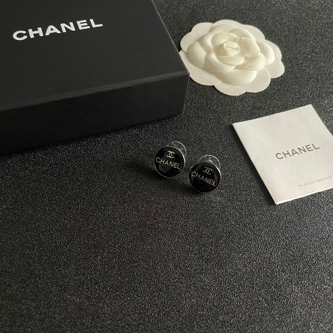 Martin Graham stud earrings in polished metal-tone – styled product view
