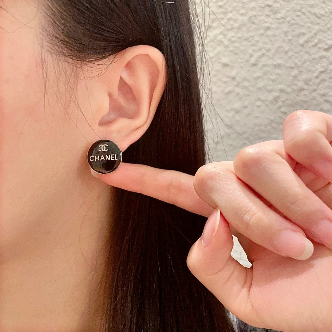 Martin Graham stud earrings in polished metal-tone – front product view
