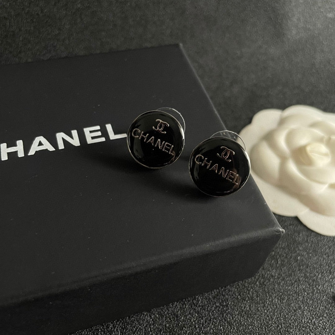 Martin Graham stud earrings in polished metal-tone – detail view