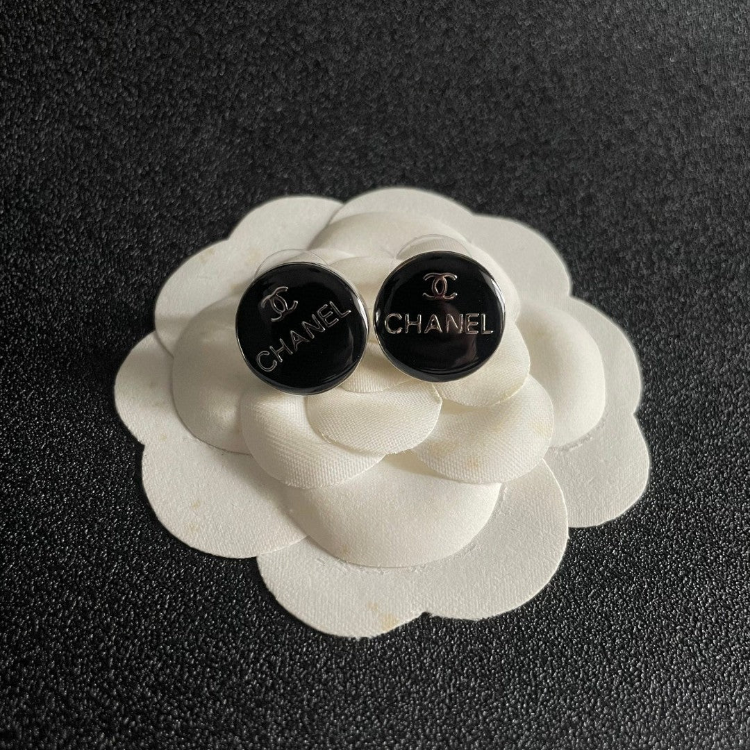Martin Graham stud earrings in polished metal-tone – front product view