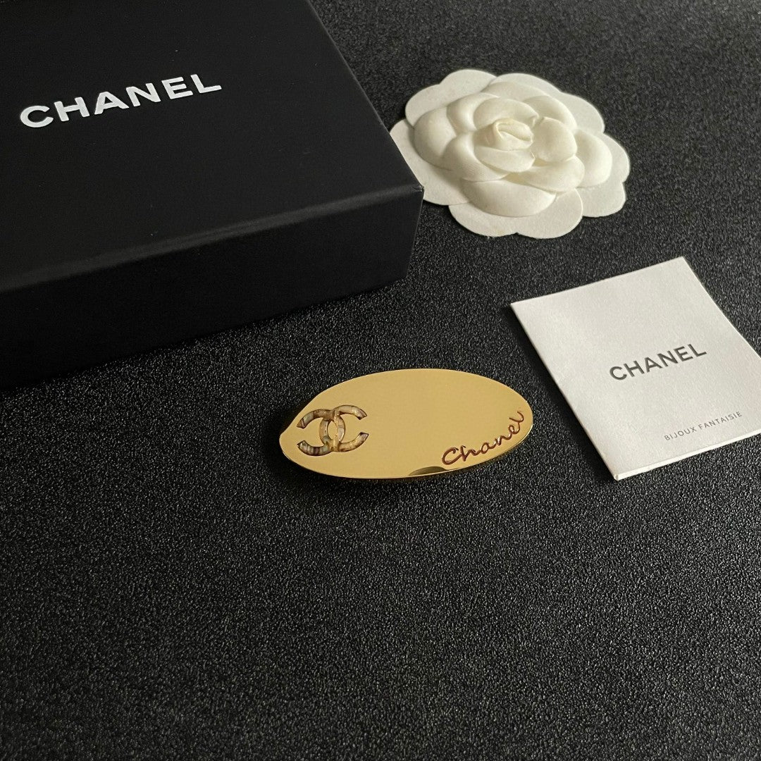 Martin Graham Double-C hair accessory in polished metal-tone – styled product view