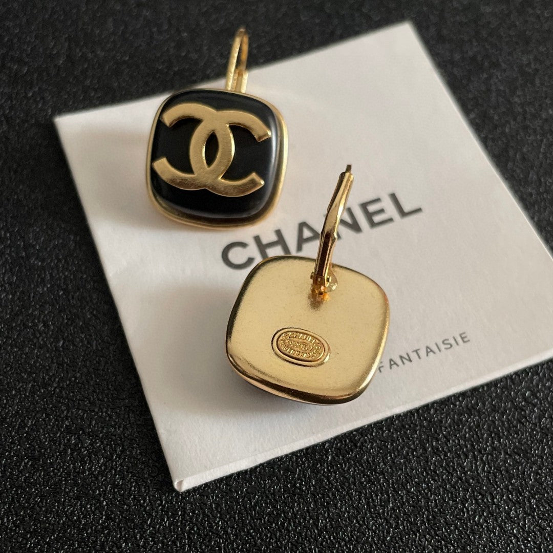 Martin Graham earrings in polished metal-tone – close-up detail