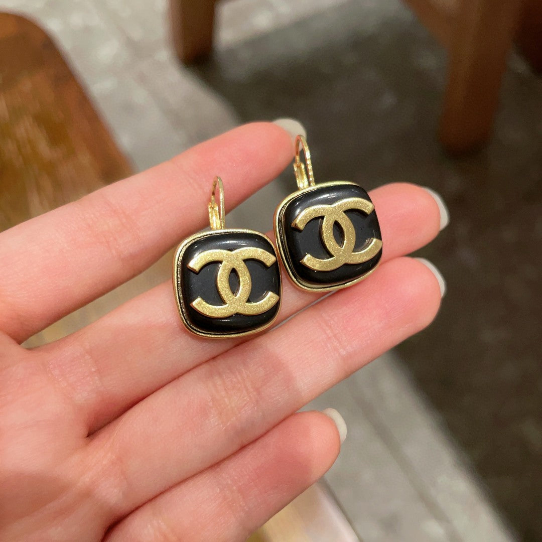 Martin Graham earrings in polished metal-tone – front product view