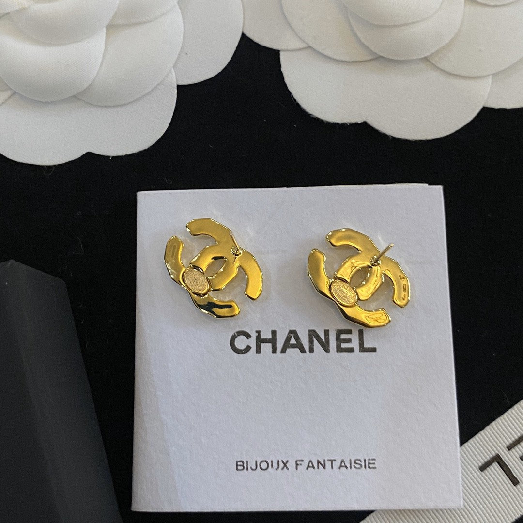 Martin Graham stud earrings in polished metal-tone – close-up detail