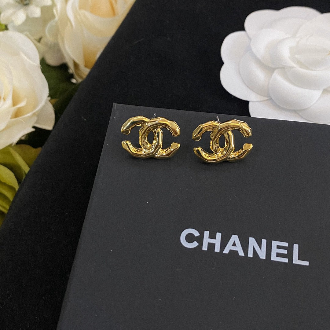 Martin Graham stud earrings in polished metal-tone – styled product view