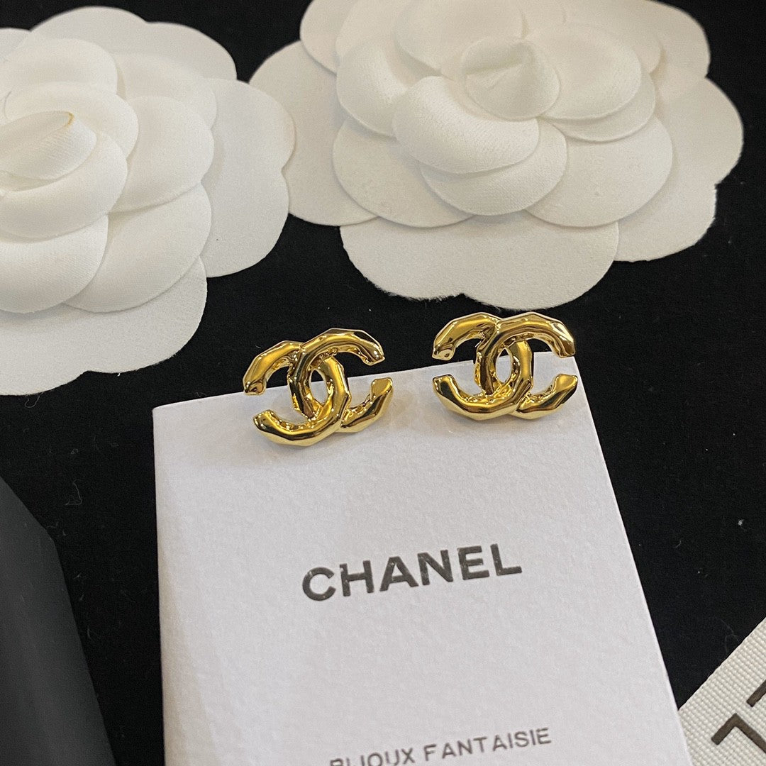 Martin Graham stud earrings in polished metal-tone – front product view