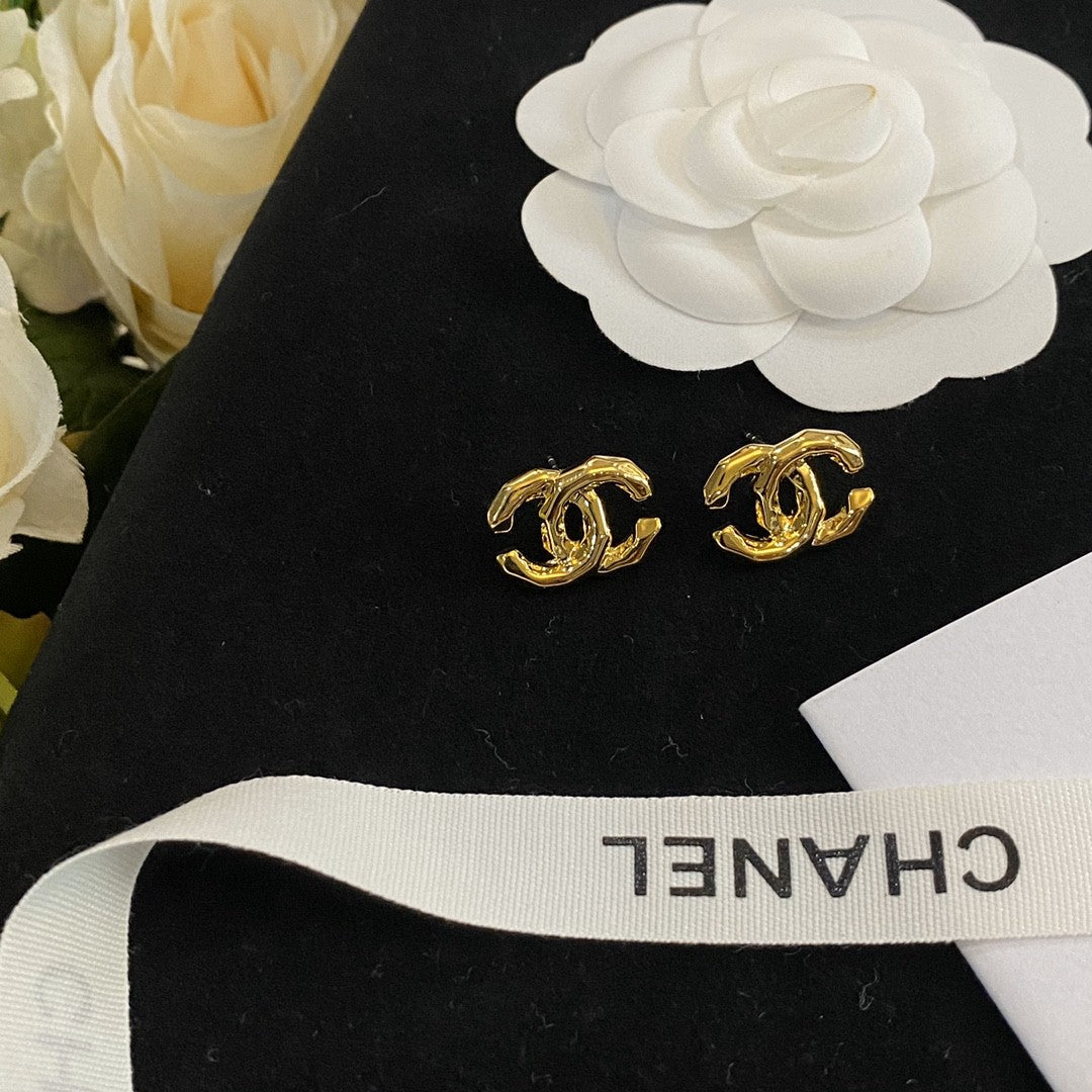 Martin Graham stud earrings in polished metal-tone – detail view