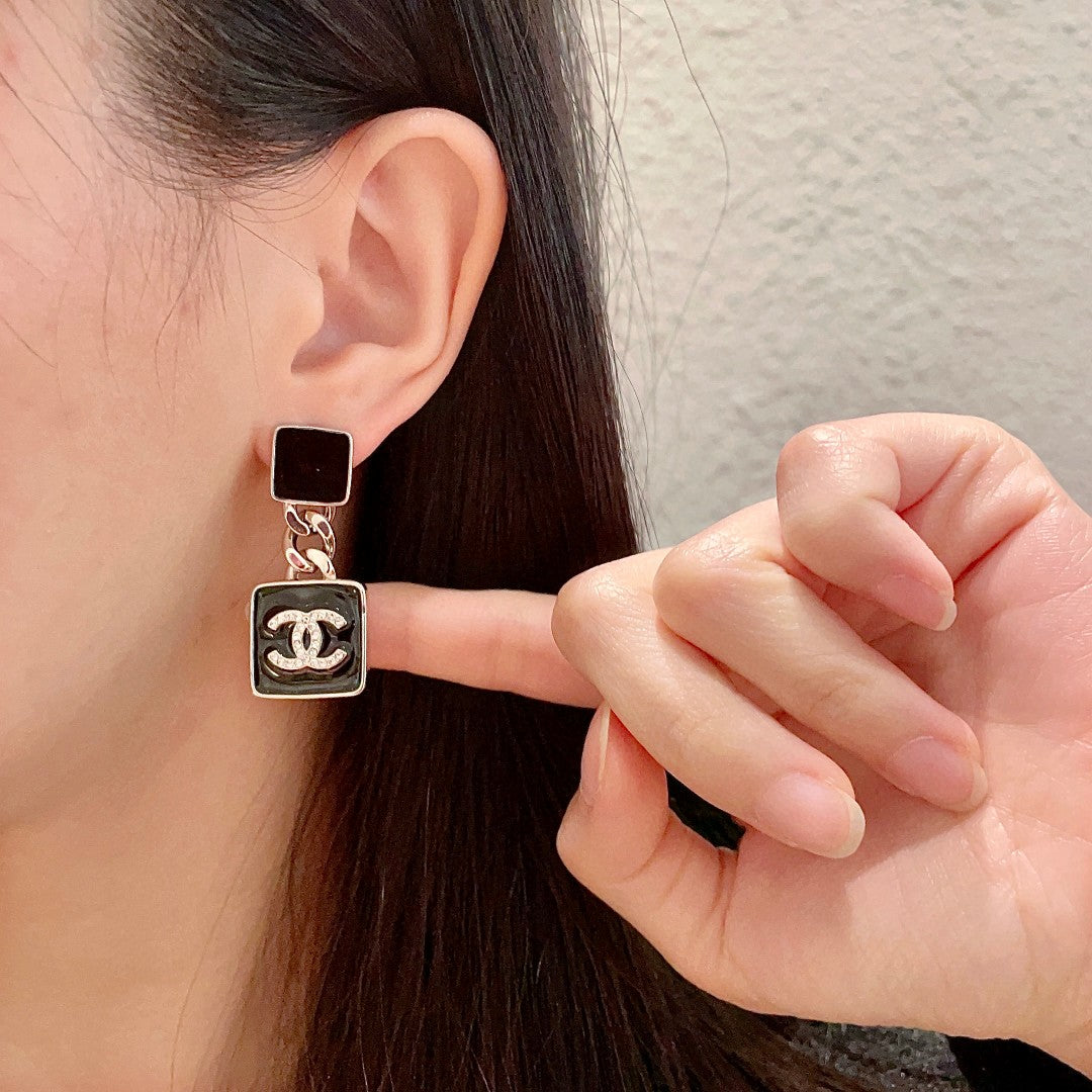 Martin Graham earrings in polished metal-tone – front product view