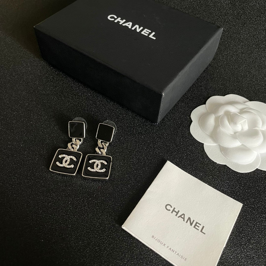 Martin Graham earrings in polished metal-tone – close-up detail