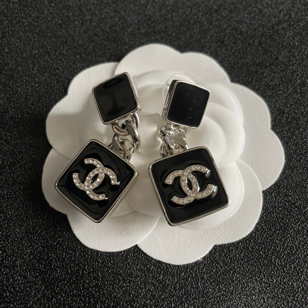 Martin Graham earrings in polished metal-tone – front product view